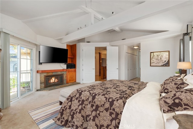 bedroom with vaulted ceiling with beams, light carpet, and access to exterior