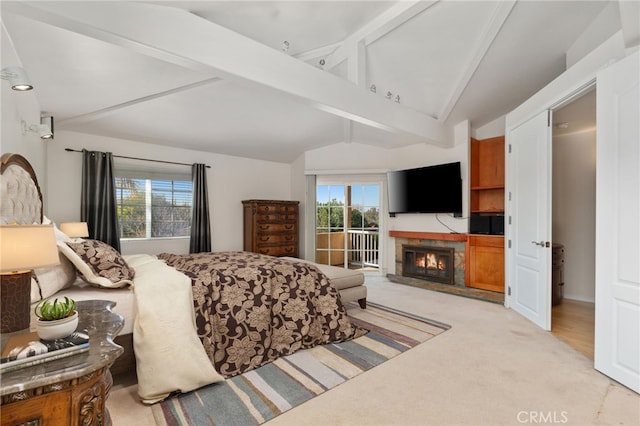 carpeted bedroom with lofted ceiling with beams, access to outside, a fireplace, and multiple windows