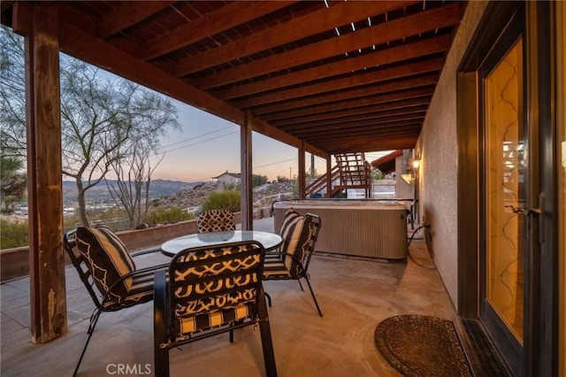 patio terrace at dusk with a mountain view