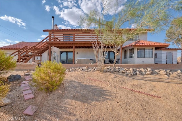 view of front of home with a wooden deck