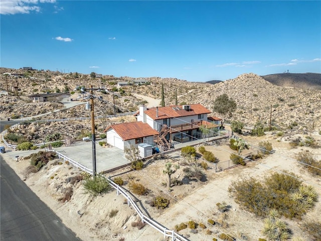 birds eye view of property with a mountain view