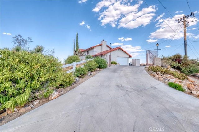 view of property exterior featuring a garage