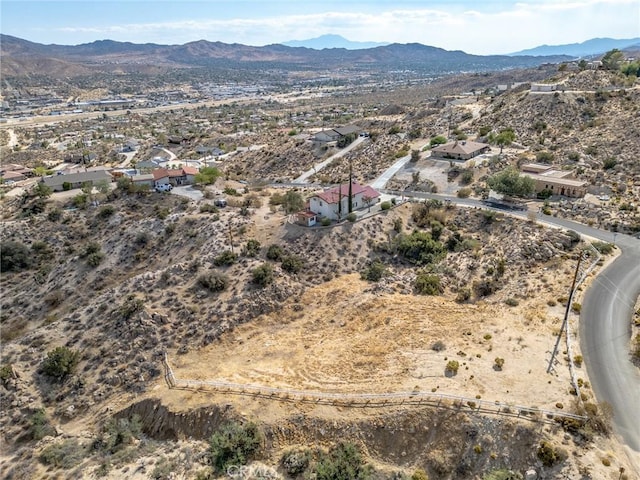 drone / aerial view featuring a mountain view