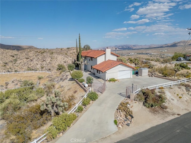 drone / aerial view featuring a mountain view