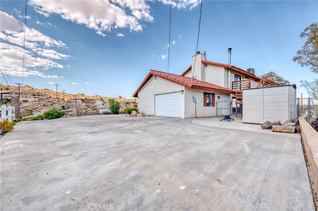 view of property exterior featuring a garage