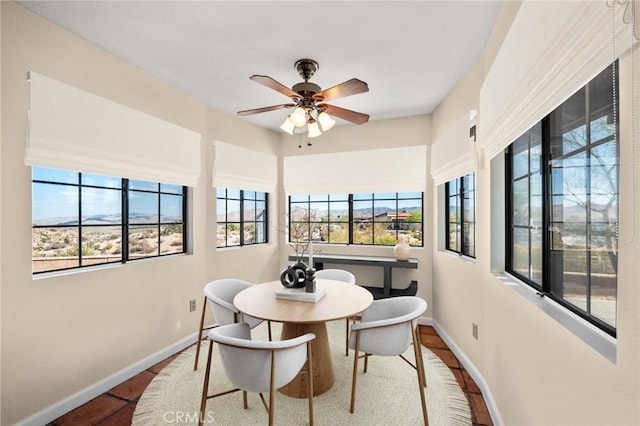 dining area featuring hardwood / wood-style flooring, ceiling fan, and a healthy amount of sunlight