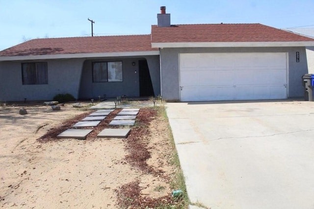 single story home featuring a garage