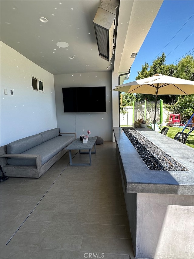 view of patio featuring an outdoor fire pit