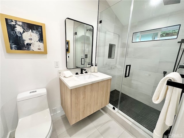 bathroom featuring vanity, toilet, tile patterned floors, and a shower with door