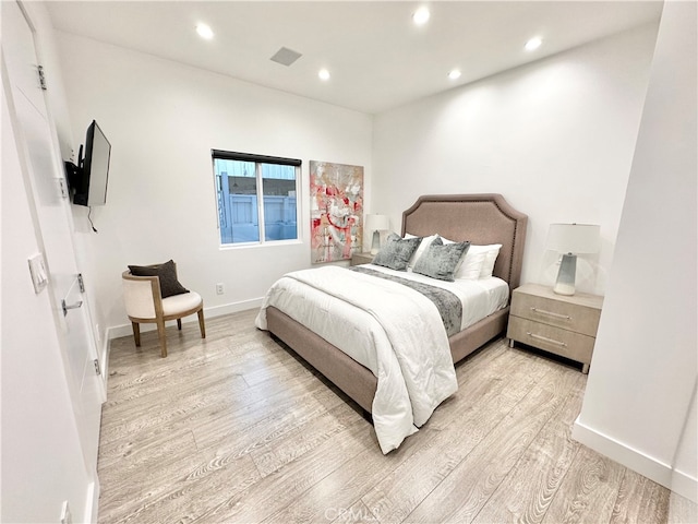 bedroom with light hardwood / wood-style flooring