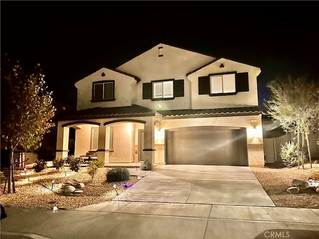 view of front of property featuring a garage