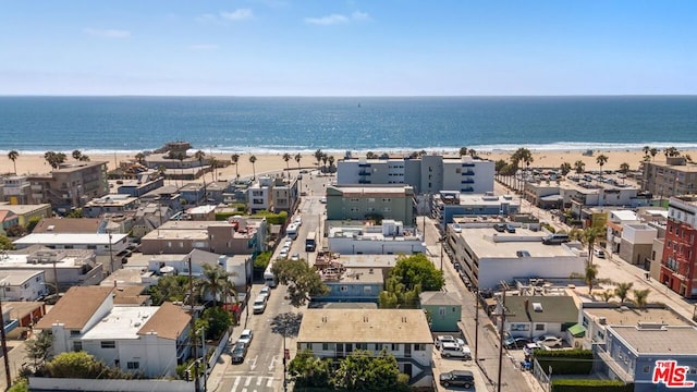 drone / aerial view with a view of the beach and a water view