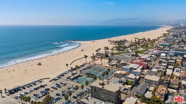 aerial view featuring a water view and a view of the beach