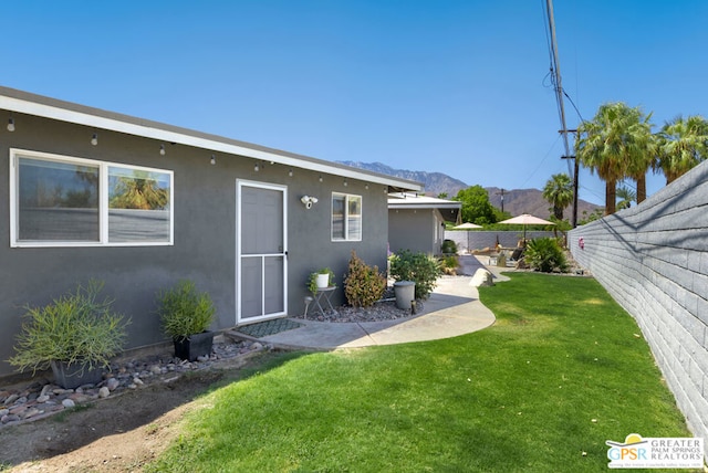 rear view of property featuring a yard