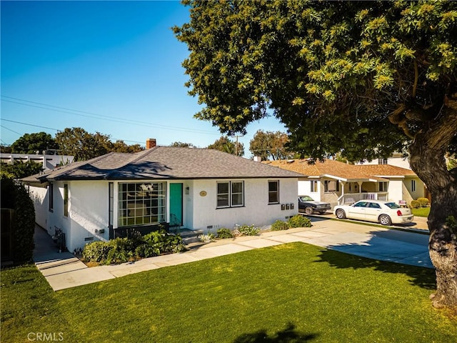 ranch-style house with a front lawn