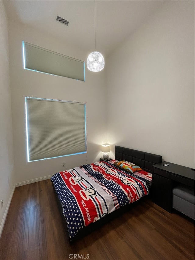 bedroom featuring dark wood-type flooring