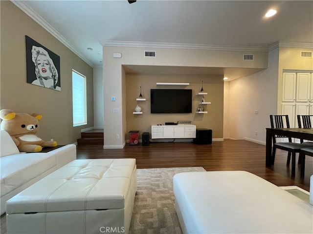 living room featuring ornamental molding and dark hardwood / wood-style floors