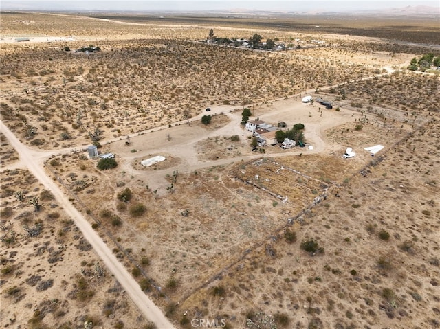 birds eye view of property featuring a rural view