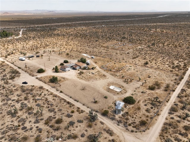 birds eye view of property featuring a rural view