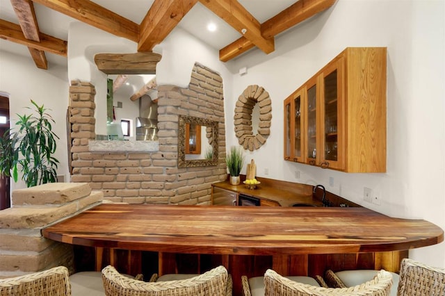 bar with sink and beamed ceiling