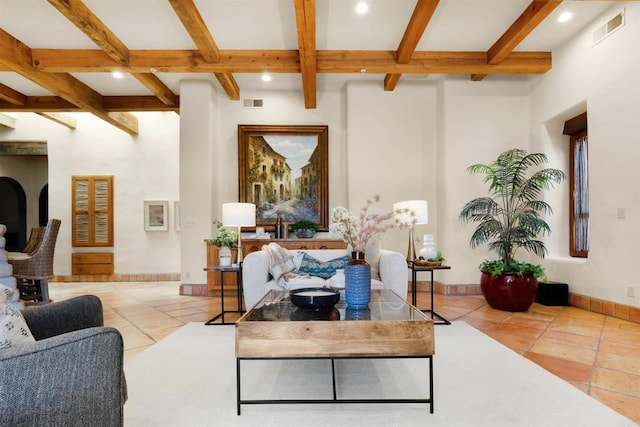 living room with light tile patterned flooring, coffered ceiling, and beamed ceiling