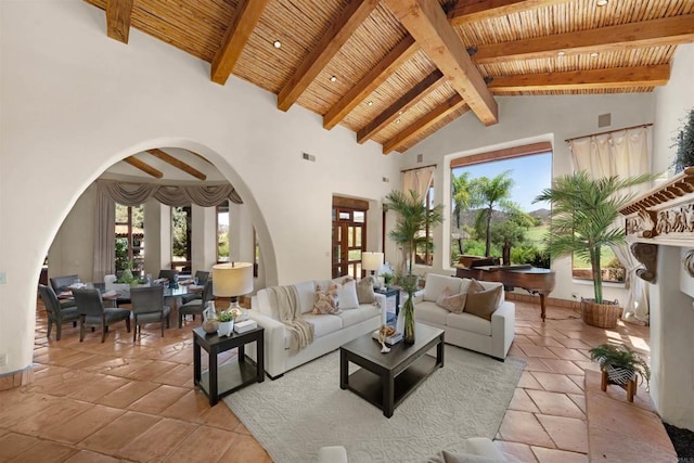 tiled living room with high vaulted ceiling, beamed ceiling, and wood ceiling