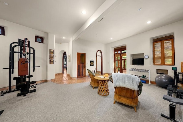 exercise room featuring light tile patterned floors