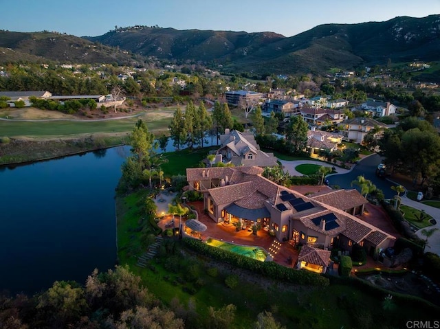 bird's eye view featuring a water and mountain view