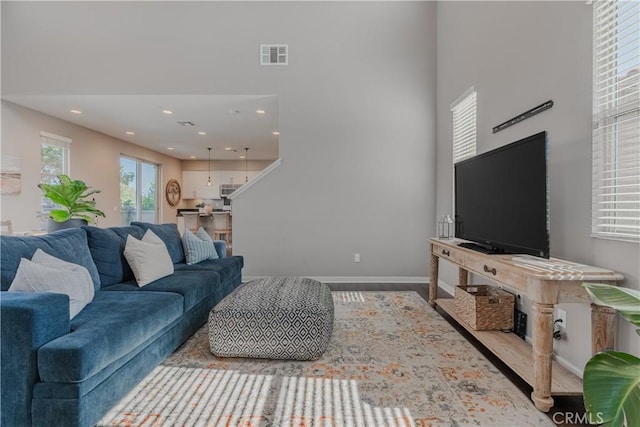 living room with a towering ceiling