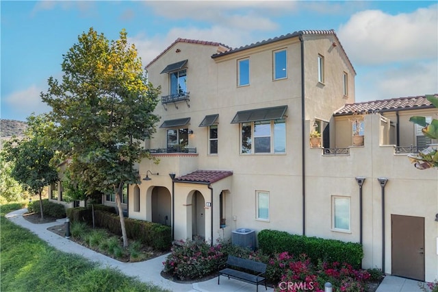 mediterranean / spanish home with central AC unit