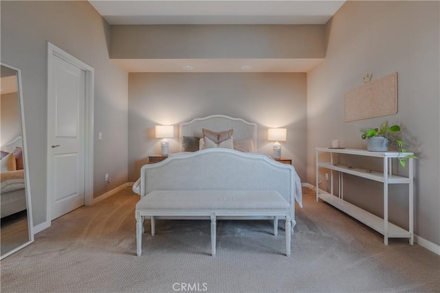 bedroom featuring light colored carpet