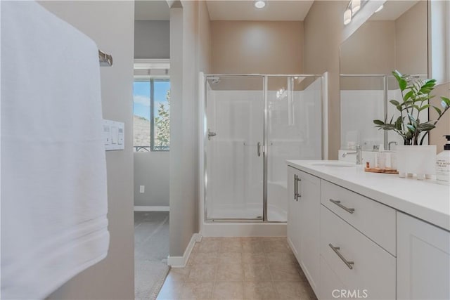 bathroom with vanity, tile patterned floors, and walk in shower