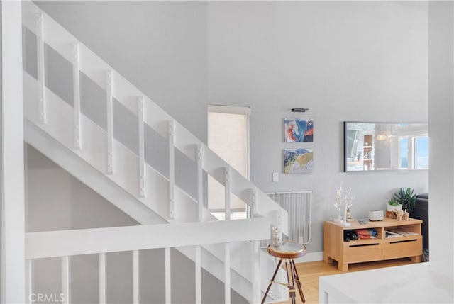 stairway with hardwood / wood-style flooring