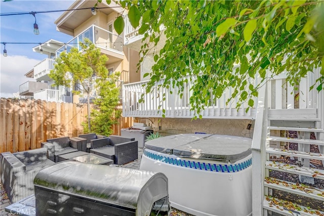 view of patio featuring a balcony and outdoor lounge area