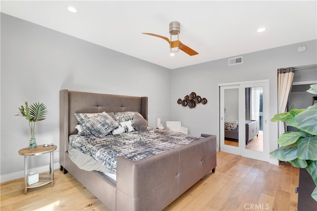 bedroom with ceiling fan and light hardwood / wood-style flooring