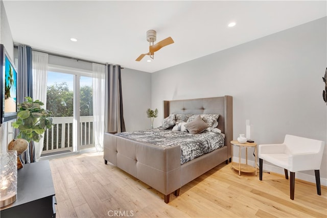 bedroom featuring light hardwood / wood-style floors, ceiling fan, and access to outside