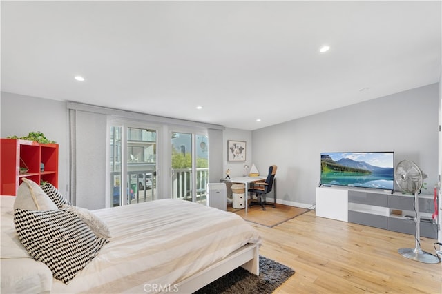 bedroom featuring access to outside and hardwood / wood-style floors