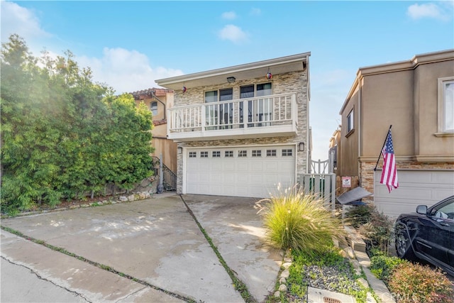 view of front of home featuring a balcony and a garage