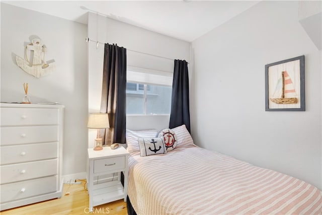 bedroom with light hardwood / wood-style flooring