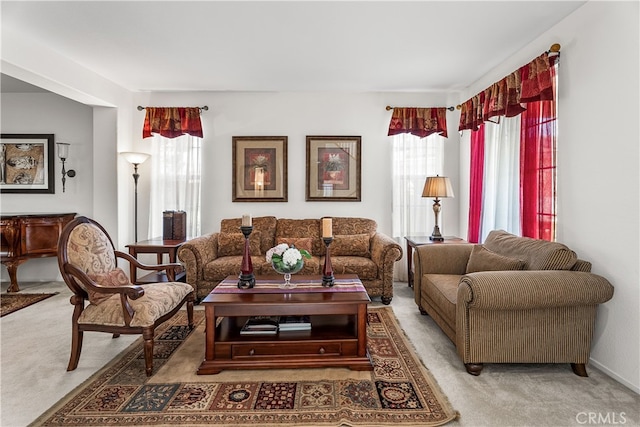 living room with carpet flooring and a healthy amount of sunlight