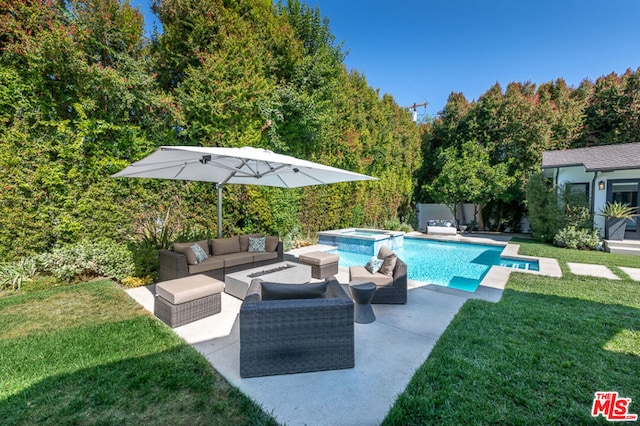 view of swimming pool featuring a patio, a yard, and an outdoor hangout area