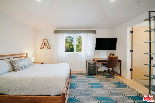 bedroom featuring hardwood / wood-style floors