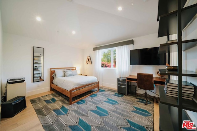 bedroom with wood-type flooring