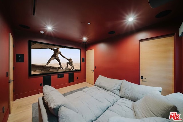 home theater room featuring light wood-type flooring