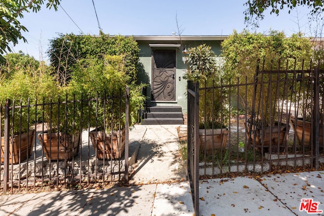 view of property hidden behind natural elements