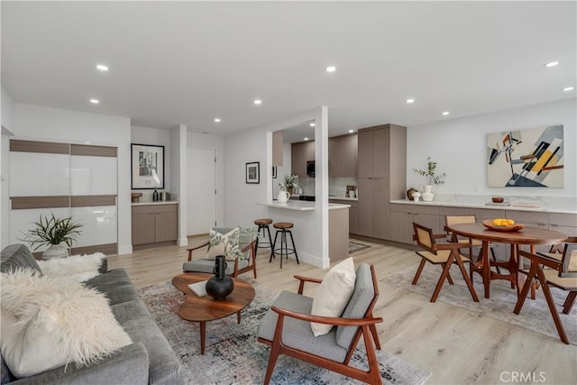 living room with light hardwood / wood-style flooring