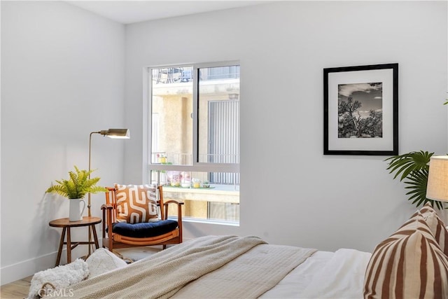 bedroom with hardwood / wood-style floors