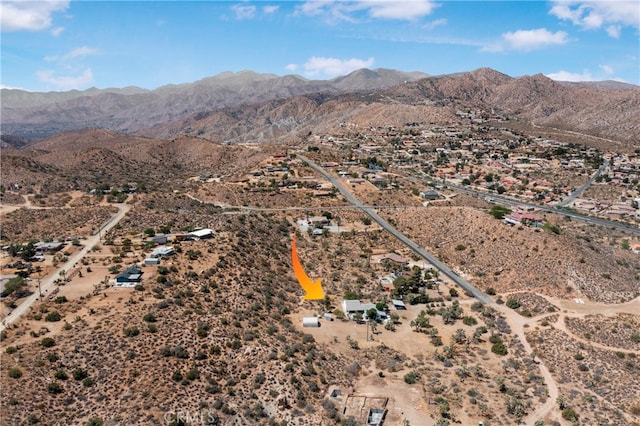 drone / aerial view featuring a mountain view