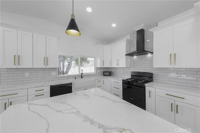 kitchen featuring hanging light fixtures, decorative backsplash, white cabinetry, wall chimney exhaust hood, and black appliances