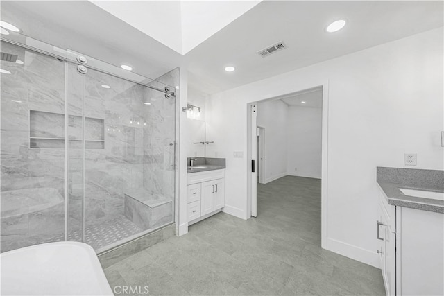 bathroom featuring shower with separate bathtub and vanity